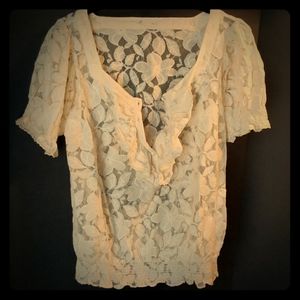.Cream-colored lace top.